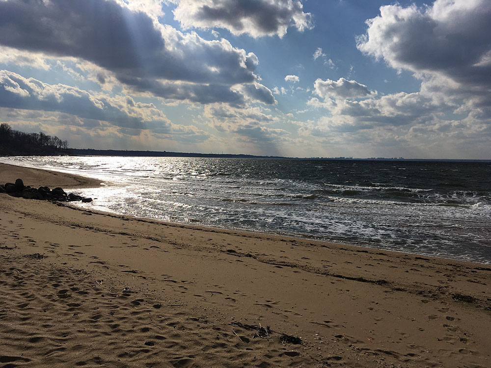 Beach and ocean at sunset scene.