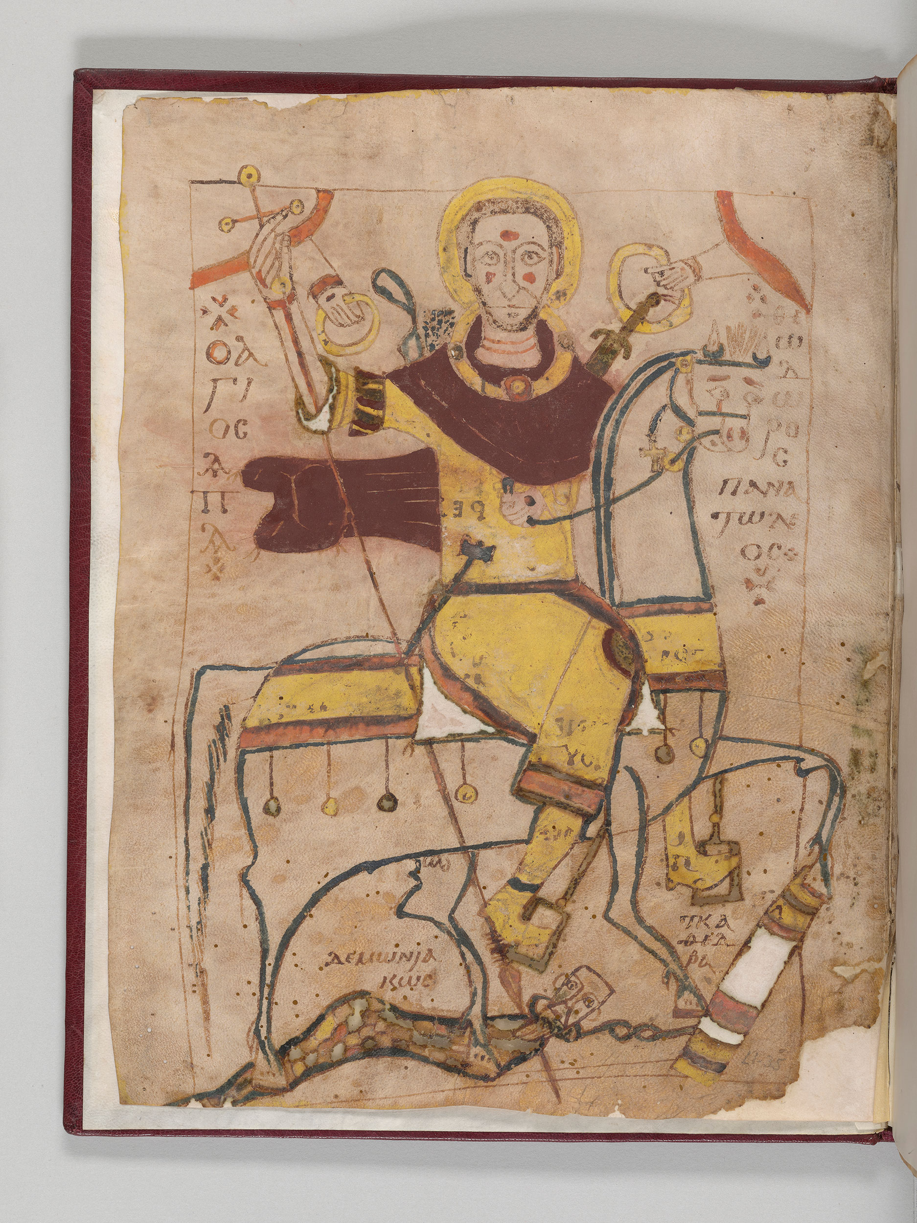 Figure in burgundy and yellow robe.