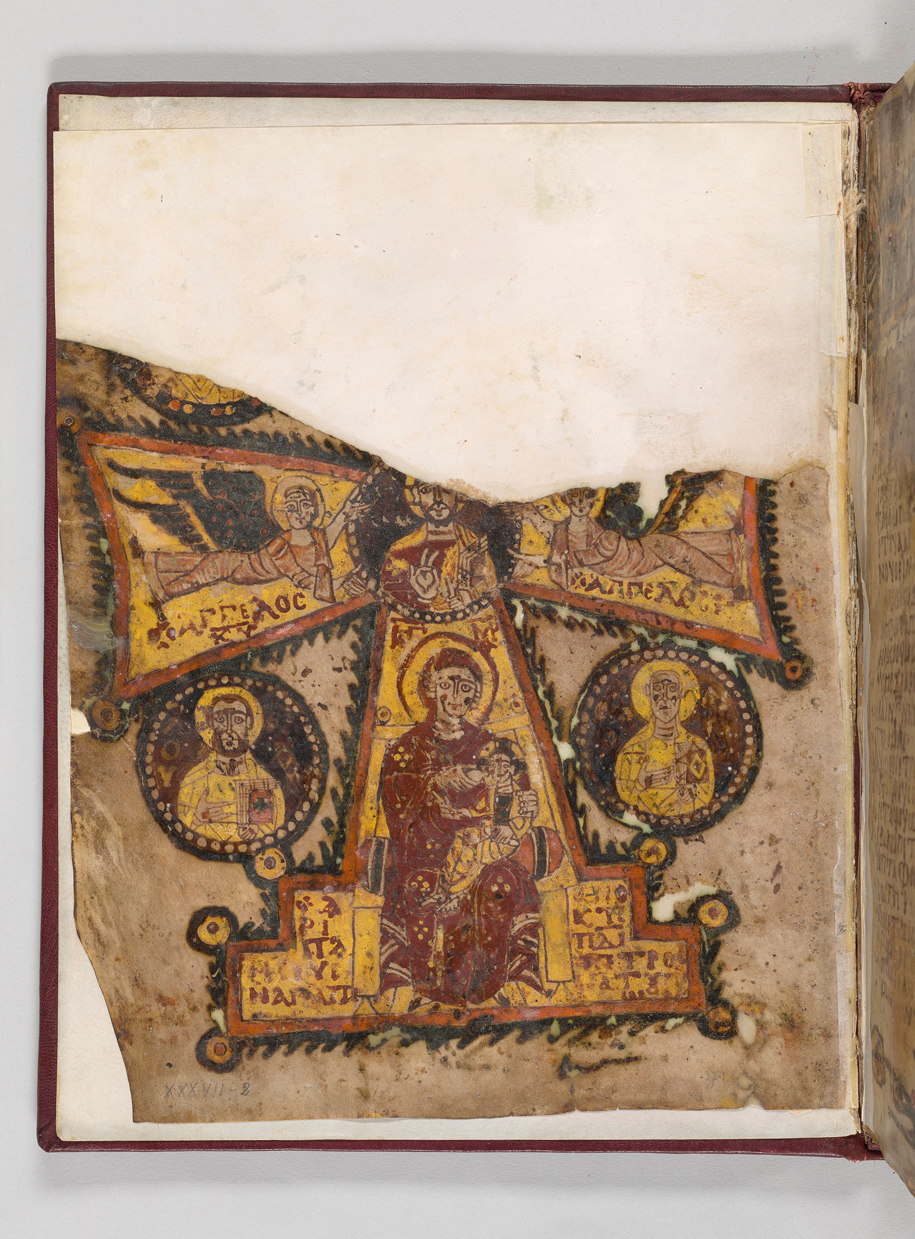 Half page of manuscript showing partial cross