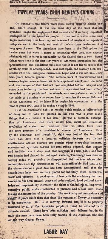 Browned newspaper clipping with printed text and headline that says